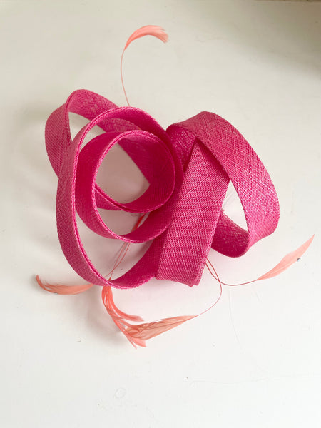 TAILOR MADE PINK STRAW COILS & CORAL FEATHER FASCINATOR ON COMB