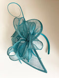 TURQOUISE BOW TRIM & COIL STICK TRIM FASCINATOR ON HEADBAND