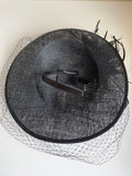 BLACK HATINATOR WITH FEATHERS AND NET TRIM ON HEADBAND